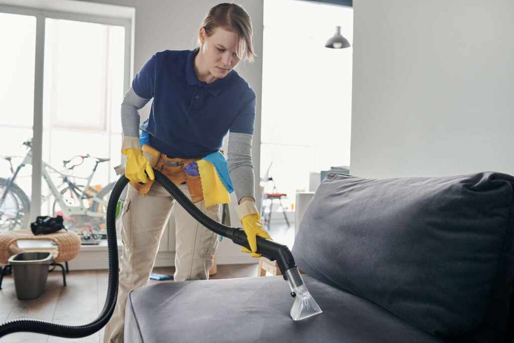 Woman cleaning upholstery